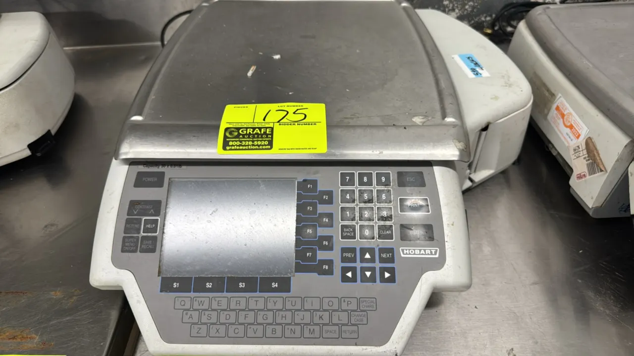 Hobart Quantum electronic scale with integrated label printer. Features 30 x 0.01 lb capacity, stainless steel weighing platter, LCD display, and alph