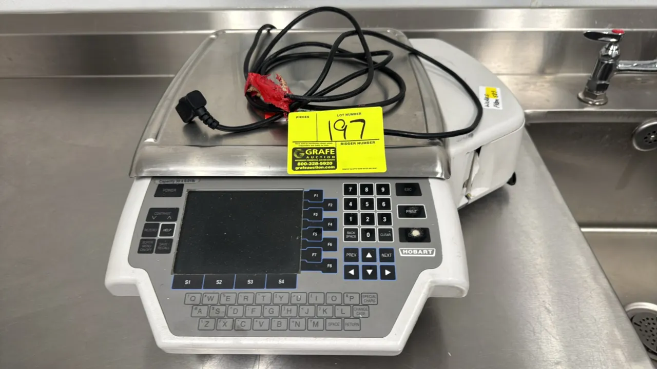Hobart Quantum electronic computing scale with integrated label printer. Features 30 lb x 0.01 lb capacity, stainless steel weighing platter, digital