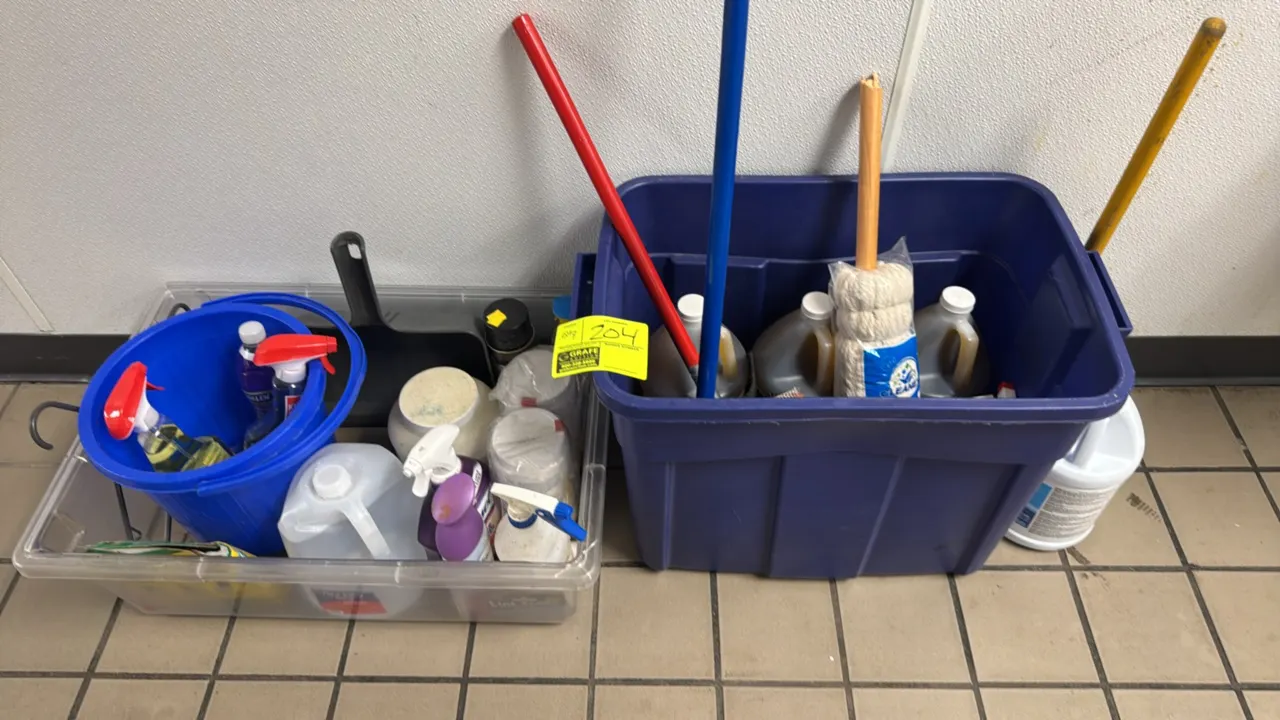 Package lot of assorted cleaning supplies with plastic storage tubs. Includes (1) blue plastic tote, (1) clear plastic tub, (1) round blue bucket, a d