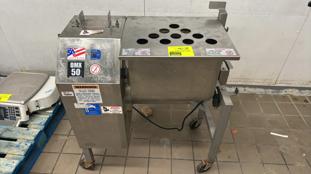 Daniels Food Equipment DMX 50 portable mixer. Features stainless steel construction, tilt hopper with perforated lid, interior paddle assembly, and fo