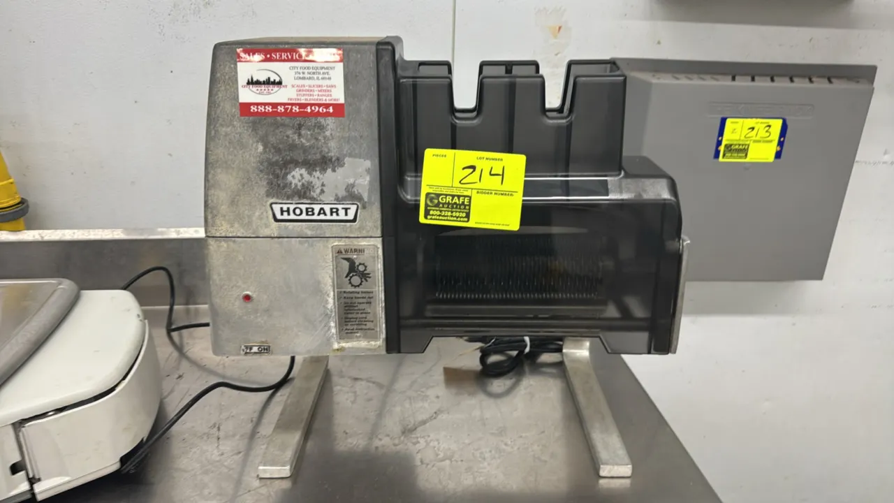 Hobart 403 Steakmaster meat tenderizer. Cast aluminum housing. Features tenderizing blade assembly and translucent safety chute. S/N: 561-114-375. Ele