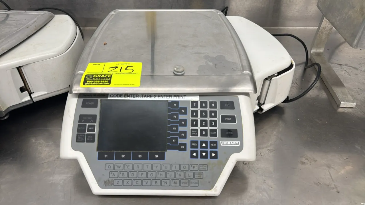 Hobart Quantum-1 electronic scale with label printer. Features 30 lb capacity (30 x 0.01 lb), stainless steel weighing platter, digital display, alpha