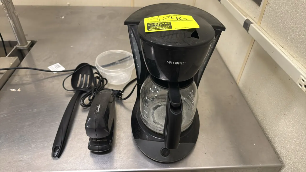 Office breakroom package lot. Includes a Mr. Coffee 12-cup coffee maker with glass carafe, a Swingline SpeedPro 25 electric stapler, a plastic slotted