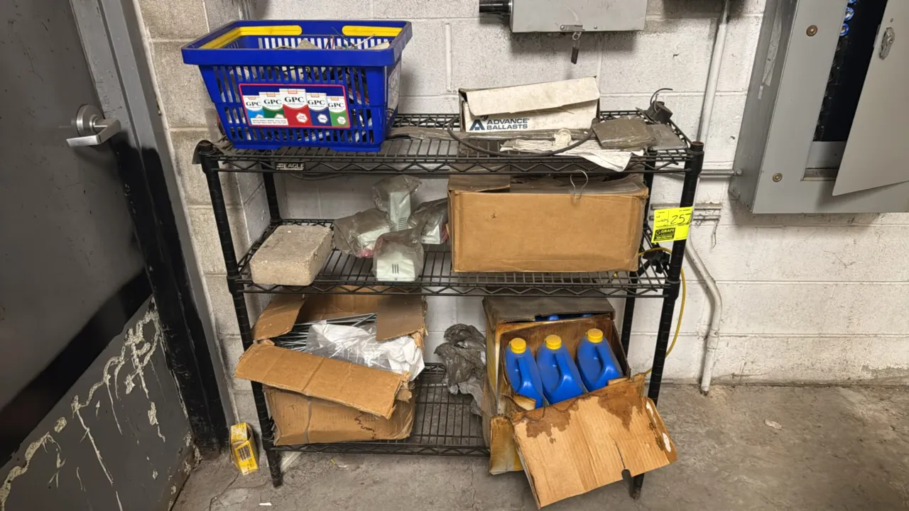 Eagle 3-tier wire shelving rack with various supplies. Features black wire construction with (3) shelves. Includes assorted electrical parts, lighting