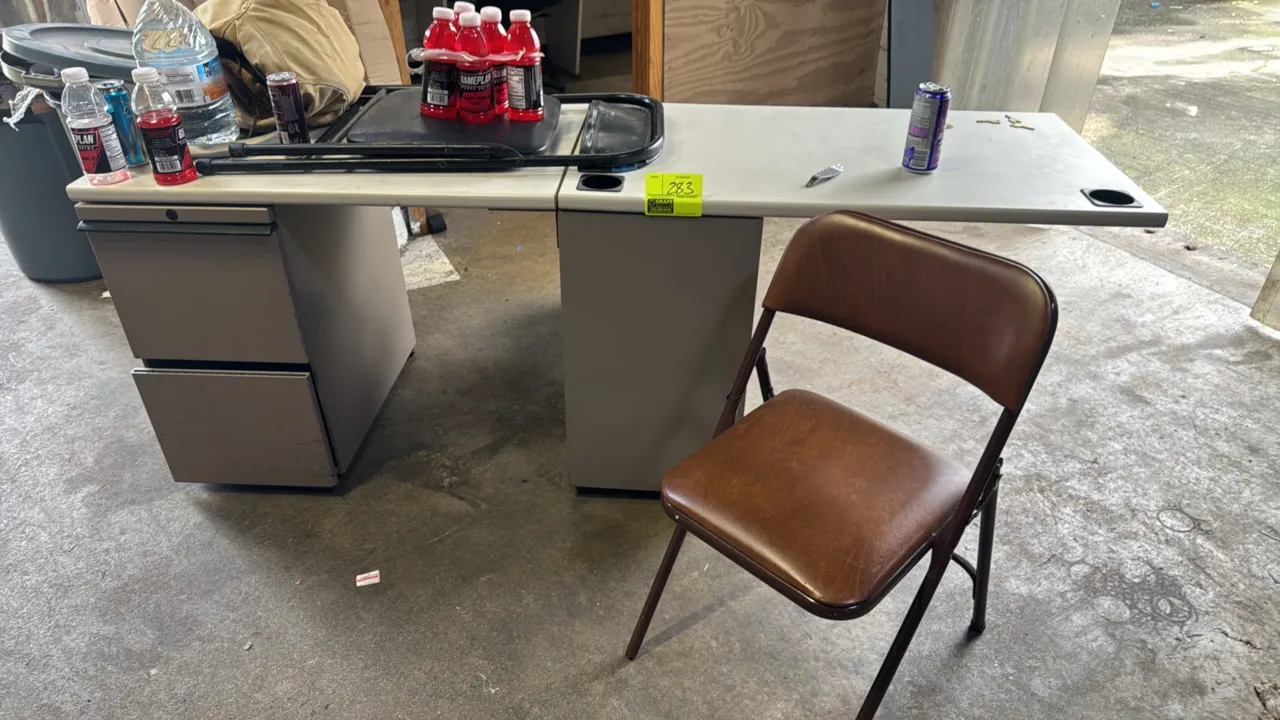Laminate office desk. Features two metal 2-drawer file pedestals, integrated cable management grommets, and includes keys. Dimensions: 6 1/2'L x 2'W.