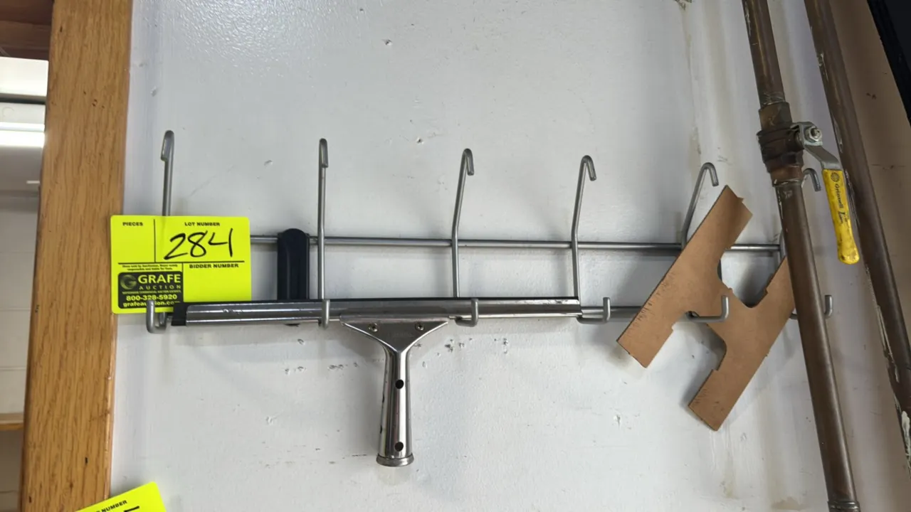 Metal wall-mount coat rack. Features wire construction with multi-hook design. 2'L. Wall-mounted design. Contents not included.