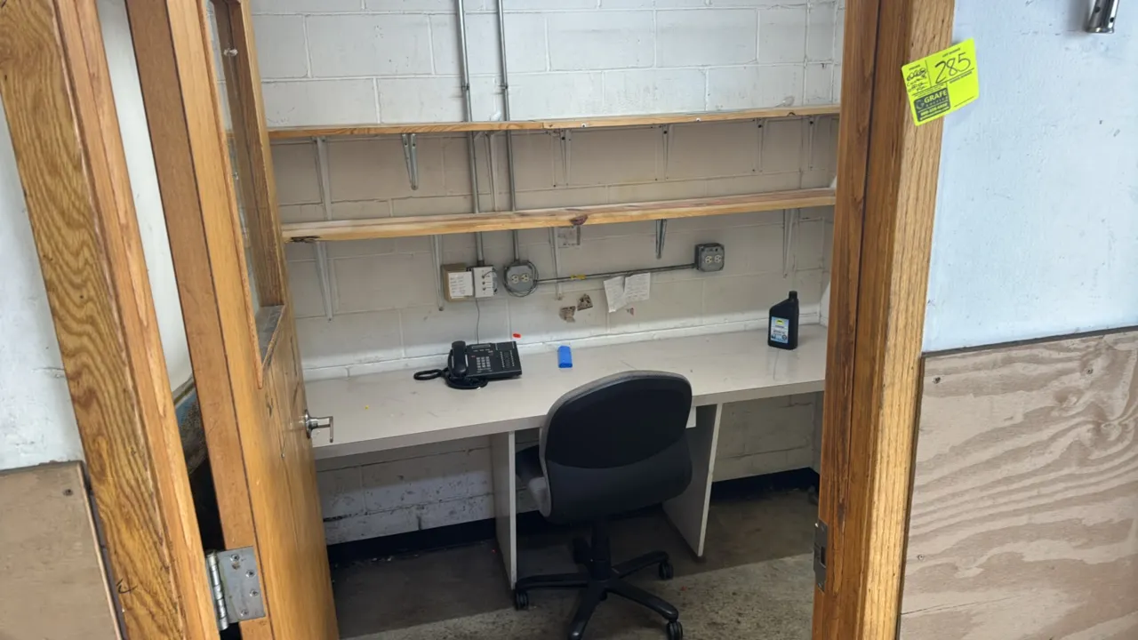 Office fixtures package lot. Includes laminate work desk, armless upholstered task chair, wall-mounted wood shelves with brackets, small wall shelf, a