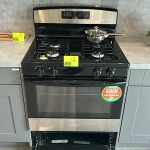 Amana AGR6303MMS0 freestanding gas range. Features 4 burners with cast grates, front burner knobs, digital touch oven controls, viewing window, stainl