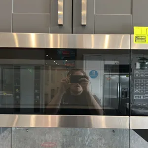 2023 Amana AMV2307PFS07 over-the-range microwave oven. Features stainless steel finish accents, digital touchpad controls, interior glass turntable, c