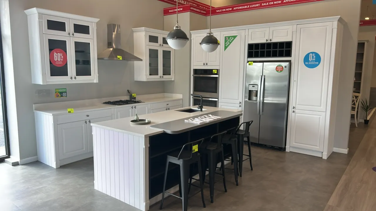 Infinity Plus kitchen cabinets with island. Includes perimeter laminate cabinets with solid surface countertops, and island with solid surface counter
