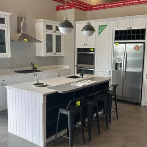 Infinity Plus kitchen cabinets with island. Includes perimeter laminate cabinets with solid surface countertops, and island with solid surface counter