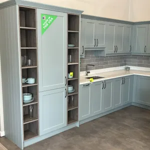 Wren Kitchens Infinity Plus kitchen cabinet display. Features laminate shaker-style cabinetry, tall pantry cabinet, upper open cubby unit, solid surfa
