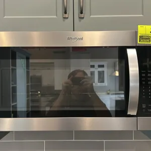 2023 Whirlpool WMH32519HZ07 over-the-range microwave oven. Features stainless steel exterior, electronic touch controls, glass turntable, and interior