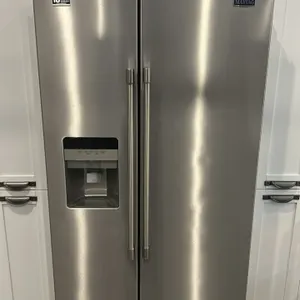 2023 Maytag MSS25C4MGZ06 stainless steel side-by-side refrigerator. Features exterior water and ice dispenser, in-door ice maker, interior glass shelv