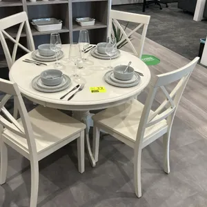 Wooden circular dining table with (4) matching chairs and assorted smallwares. Features off-white painted wood construction, pedestal table base, and 