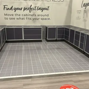 Modular base cabinet showroom display units. Features aluminum extrusion frames, dark gray laminate panels, labeled tops, and raised toe kicks. Includ