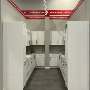 Infinity Plus laminate kitchen cabinet set. Features white shaker-style cabinetry, tall pantry cabinets, marble-look laminate countertops, (2) single-