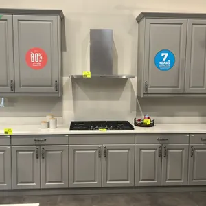 Infinity Plus laminate kitchen cabinet suite. Features gray raised-panel doors and drawers, upper and lower cabinetry, built-in upper wine rack, open 