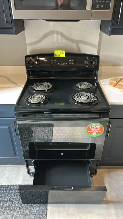 GE JB256DM3BB freestanding electric range. Features 4 coil heating elements, digital display controls, oven window, 2 interior wire racks, and lower s