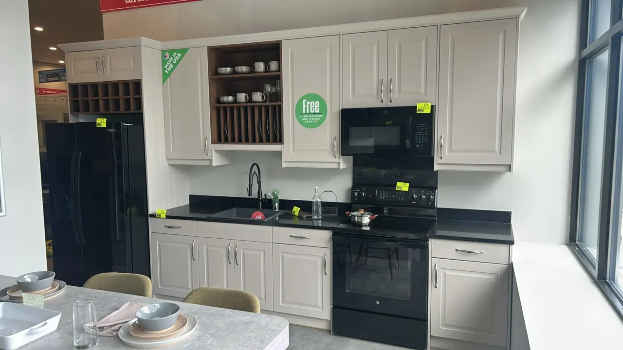 Infinity Plus laminate kitchen cabinet set with solid surface countertop and Bocchi single-bowl sink. Features upper and lower cabinets, drawers, inte