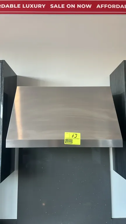 GE Profile UVW93042PSS commercial style wall-mount range hood. Features stainless steel construction, push-button controls, dual cooktop lighting, and