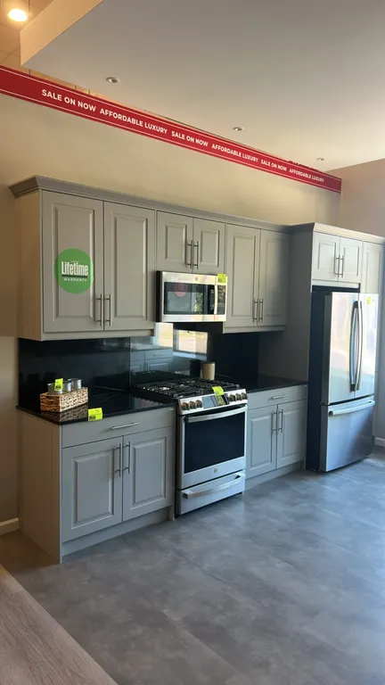 Infinity Plus kitchen cabinets with laminate and butcher block countertops. Includes Bocchi sink with stainless steel faucet, upper and lower cabinetr