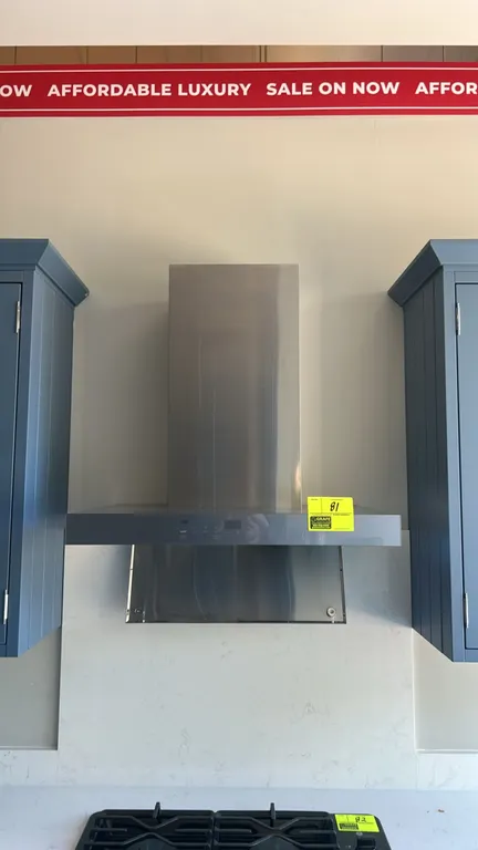 GE Profile UVW9301SL1SS smart designer wall-mount range hood. Features stainless steel construction, front digital touch controls, integrated cooktop