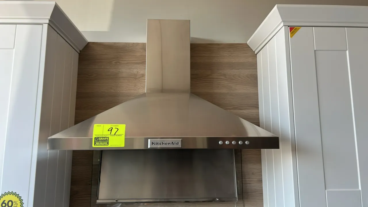 KitchenAid KVWB400DSS4 convertible wall-mount range hood. Features stainless steel finish, push-button controls, and integrated lighting. 30"W. S/N: X