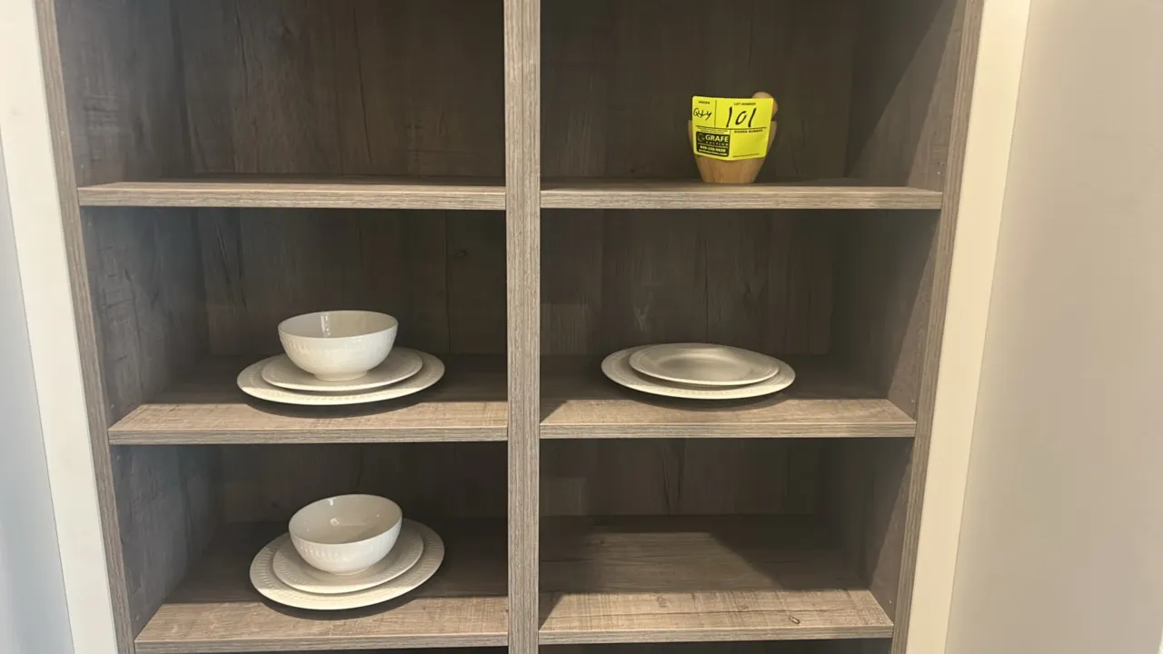 Assorted smallwares and dishware. Includes (6) white ceramic plates with embossed rim detailing, (2) matching ceramic bowls, and (1) small wooden mort