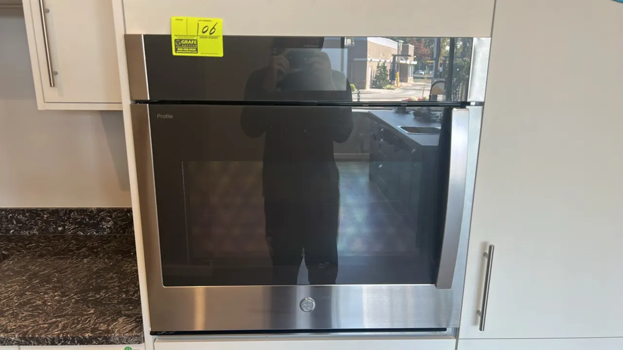 GE Profile PTS700LSN2SS 30" smart built-in convection single wall oven. Features stainless steel finish, left-hand side-swing door, and interior racks