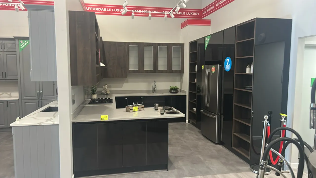 Infinity Plus laminate kitchen cabinet display set with solid surface countertop. Includes stainless steel undermount sink, pull-down faucet, gloss bl
