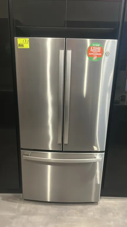 GE GWE23GYNHFS French-door refrigerator with bottom freezer. Features stainless steel finish, TwinChill system, adjustable glass shelving, ClimateZone