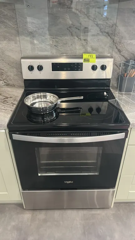 Whirlpool WFE320M0JS3 freestanding electric range. Features stainless steel finish, 4-element smooth glass cooktop, electronic oven controls, windowed