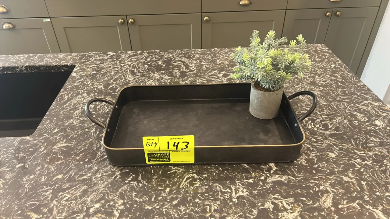 Assorted kitchen smallwares and decor. Includes ceramic plates and bowls, black mugs, drinking glasses, stainless steel pots with glass lids, metal se
