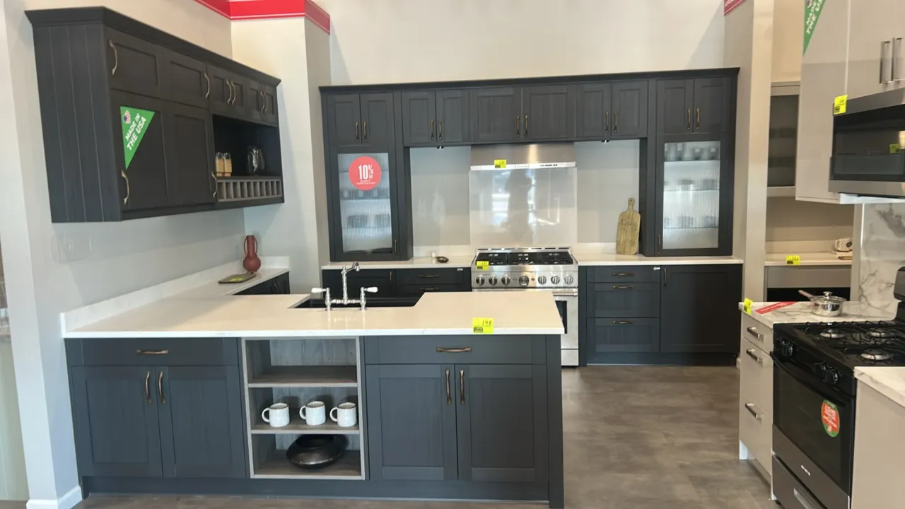Infinity Plus laminate kitchen cabinet suite. Features solid surface countertops, reeded glass cabinet doors, integrated wine rack, Blanco undermount