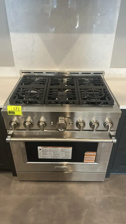 KitchenAid KFGC506JSS07 commercial-style gas range. Features stainless steel construction, 6 burners with continuous cast iron grates, smart appliance