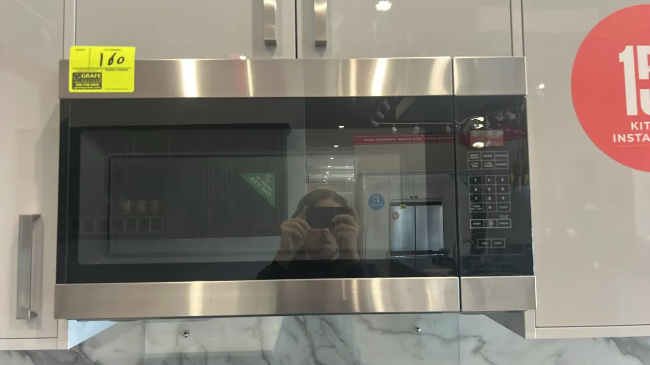 2021 Amana AMV2307PFS07 over-the-range microwave oven. Features stainless steel finish, digital touchpad controls, and interior glass turntable. S/N:
