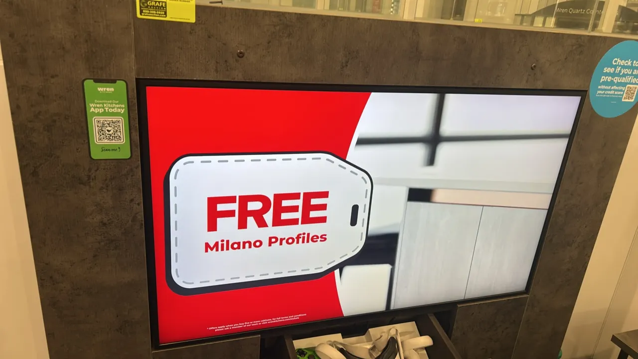49" flatscreen built-in display monitor. Integrated into a textured gray laminate cabinet surround with lower drawer. 49" screen. Contents and surroun