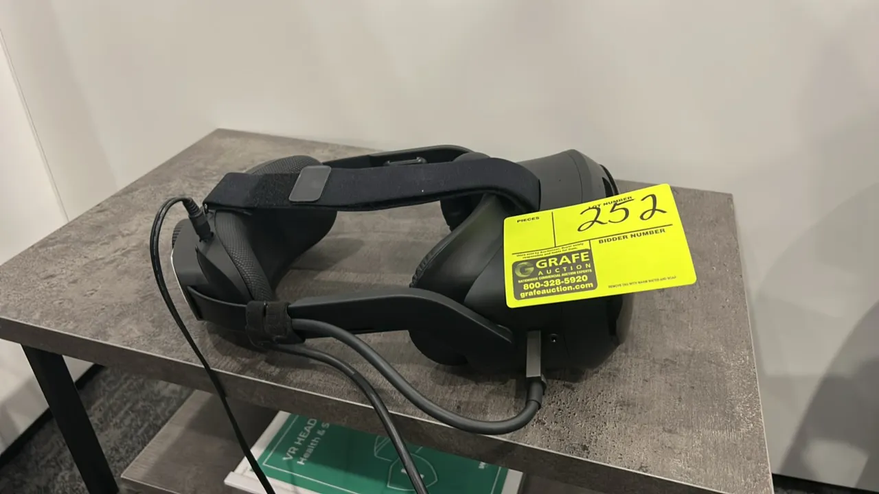 HTC Vive Focus Vision mixed reality and PC VR headset. Features adjustable head strap with rear tension dial, padded face cushion, front-facing tracki
