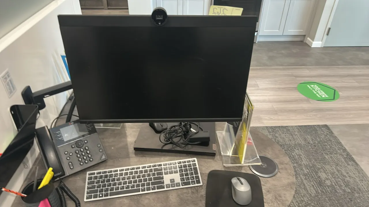 Dell P2724DEB 27" flat panel monitor. Features integrated webcam. Includes wireless keyboard, mouse, and articulating wall mount arm. Electrical: 240V