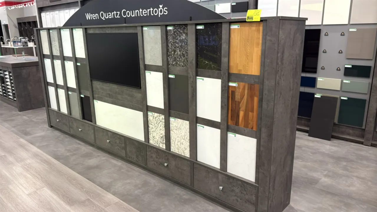 Wren double-sided countertop sample display fixture. Features quartz countertop display on one side with integrated 42" color monitor and bottom drawe