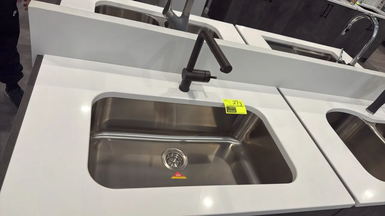 Blanco 30" single-bowl stainless steel undermount sink with pull-out faucet. Features satin finish, drain with basket strainer, and single-handle pull