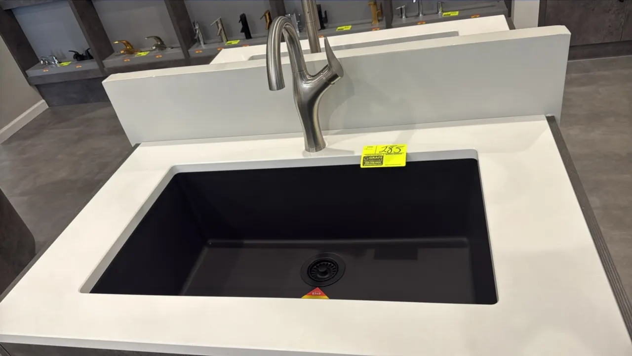 Blanco 33" single-bowl dual-mount composite kitchen sink in matte black finish. Includes matching basket strainer drain and single-handle stainless st