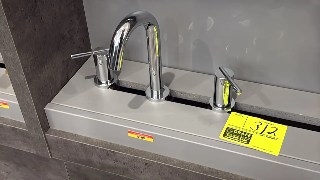 Liard FA.PIO.02.003 two-handle bathroom vanity faucet. Features a polished chrome finish, high-arc spout, and dual lever handles. Display stand not in