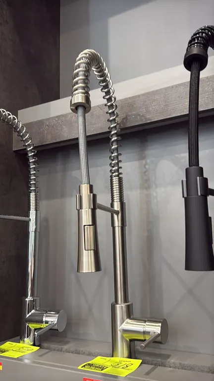 Nile FA.SAN.01.010 pull-down kitchen faucet. Features a stainless steel finish, single-lever control, high-arc open coil spring spout, and pull-down s