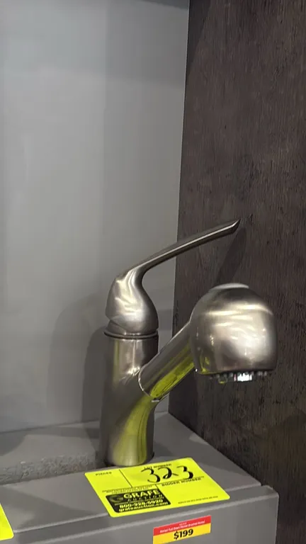 Yenisei pull-down faucet. Features a brushed nickel finish, single-handle lever control, and pull-down spray head. Note: Display stand not included.