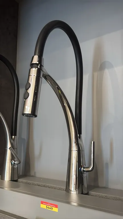 Mackenzie FA.PAL01.002 pull-down kitchen faucet. Features a polished chrome finish, flexible black gooseneck spout, pull-down spray head with dual-fun