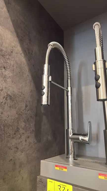 Kansas FA.PAI.01.007 pull-out kitchen faucet. Features a polished chrome finish, high-arc open-coil spring spout, dual-function spray head with push-b