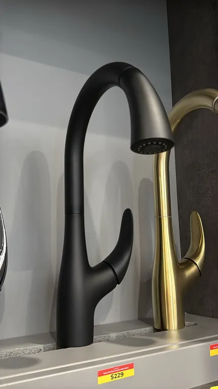 Yukon single-handle pull-down kitchen faucet. Features a matte black finish, high-arc spout, pull-down spray head, and single lever handle. Tag notes: