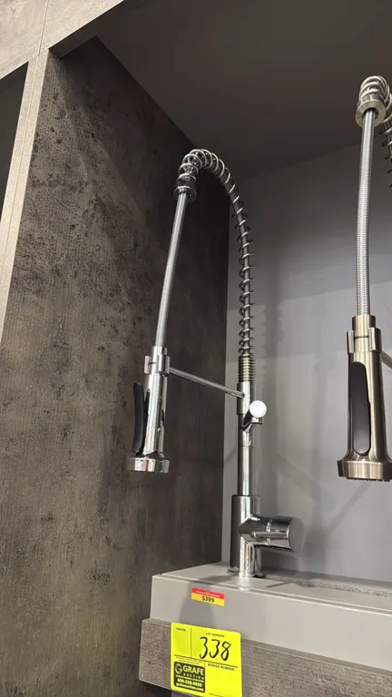 Columbia FA.SAN.01.016 dual-spout pull-down kitchen faucet. Features a chrome finish, high-arc commercial-style spring spout, pull-down spray head wit